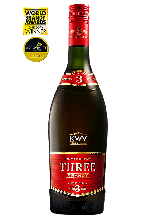 A bottle of KWV Three Brandy Centra Blend 3 Year Old spirit with a red and gold label, shown on a white background with World Brandry Awards gold seals in the top left corner.