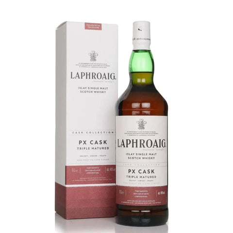 A bottle of Laphroaig PX Cask Triple Matured Scotch Whisky next to its white and dusty rose packaging box, set against a plain white background.