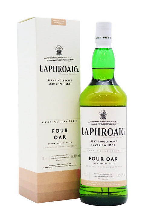 A bottle of Laphroaig Four Oak Islay Single Malt Scotch Whisky next to its matching cream-colored packaging box, set against a plain white background.